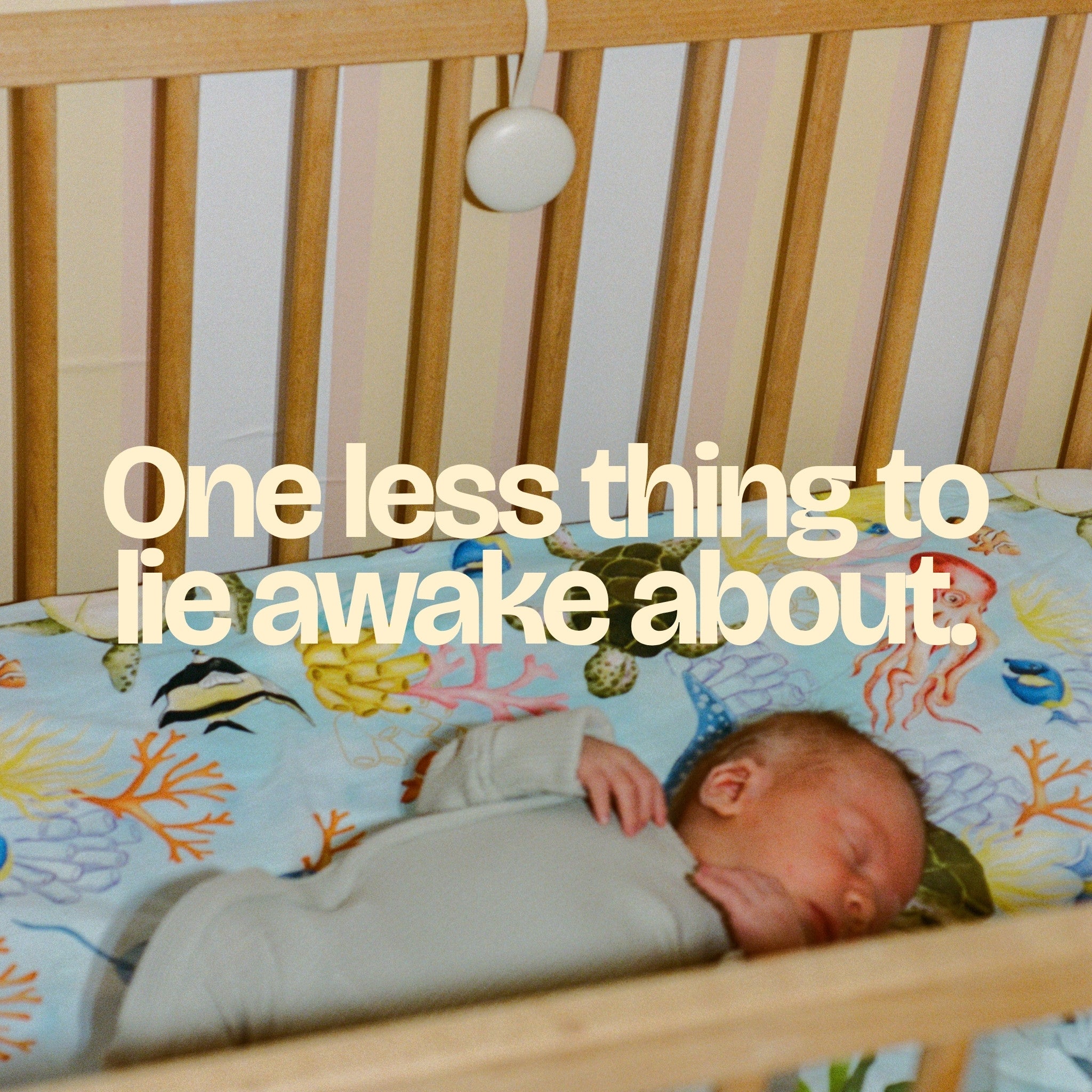 Orbie in a nursery with a baby asleep